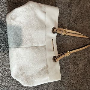White Michael Kors purse. Does have some spots that need to be cleaned